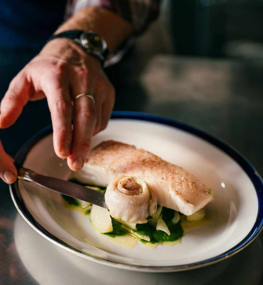 White fish being plated